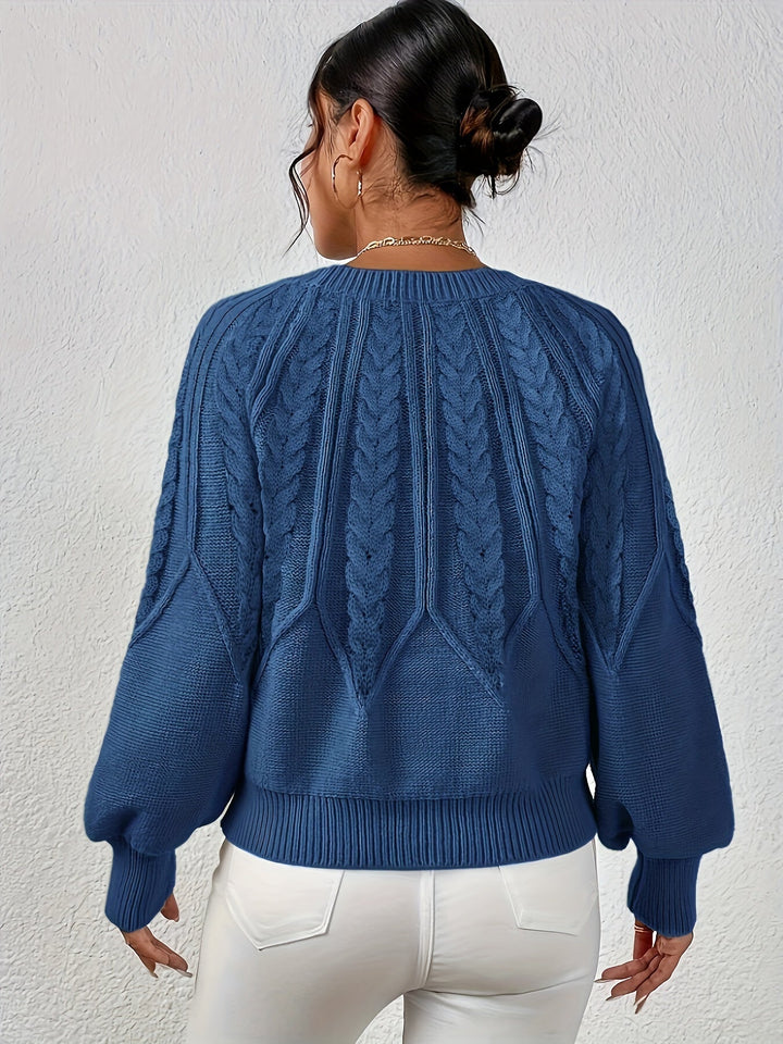 Women's warm relaxed fit cable knit sweater, ideal for cozy fall and winter outfits.