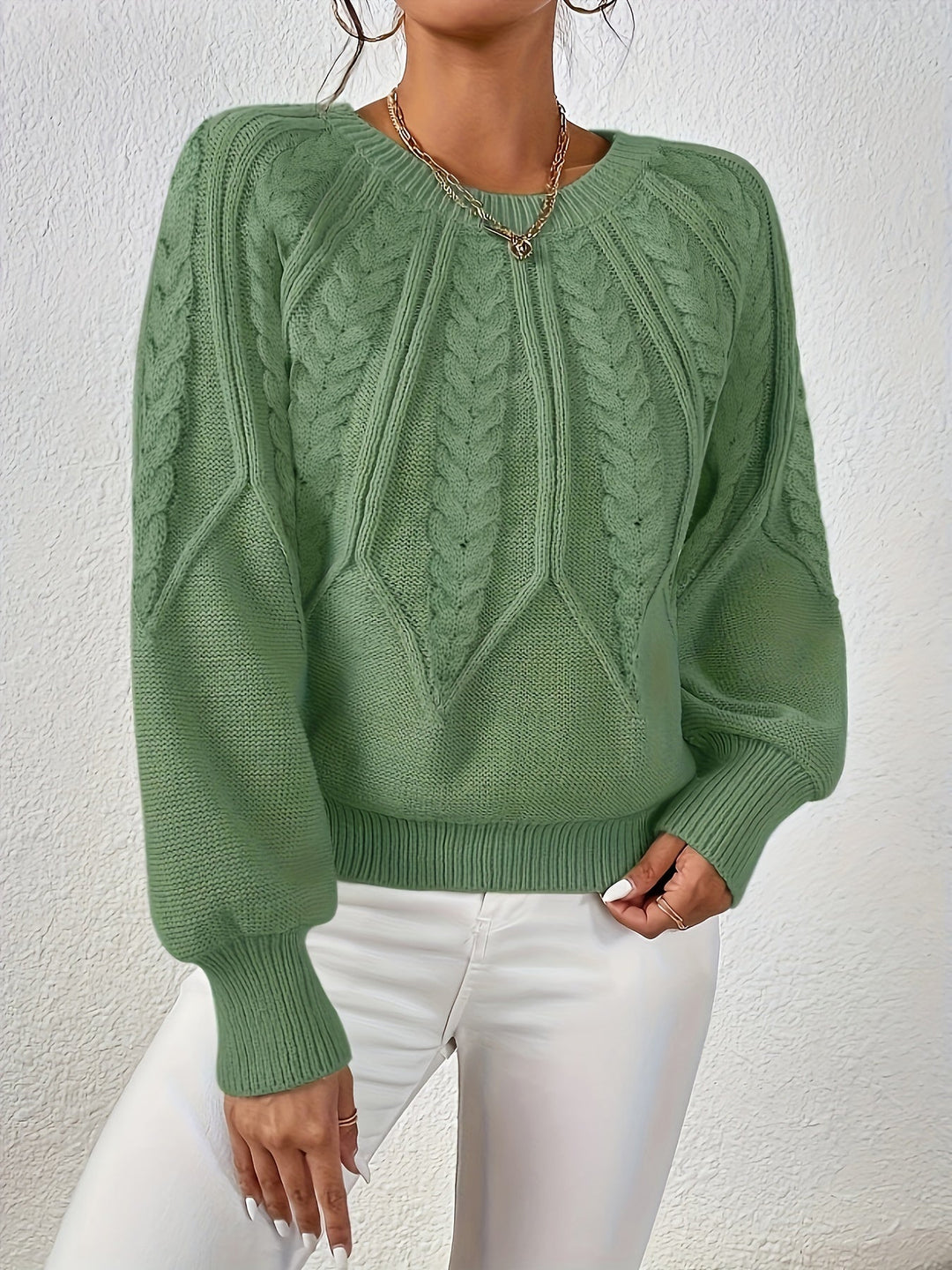 Comfortable women's chunky cable knit sweater, relaxed fit, soft for daily wear.