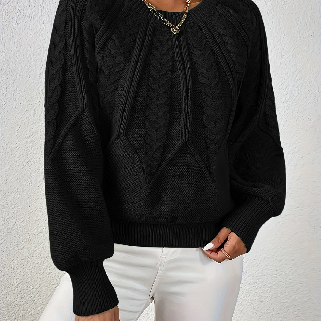 Women's elegant cable knit sweater, relaxed fit, with beautiful sleeve detail.