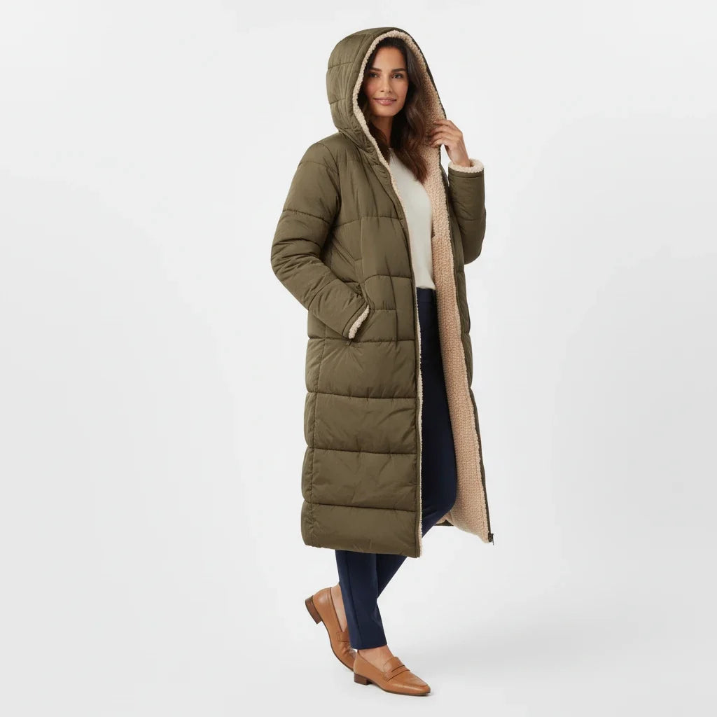 Women's black hooded puffer coat, an oversized quilted jacket for cozy winter fashion.