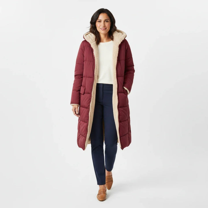 Women's hooded puffer jacket, ideal for winter essential, cozy style, & cold weather fashion.