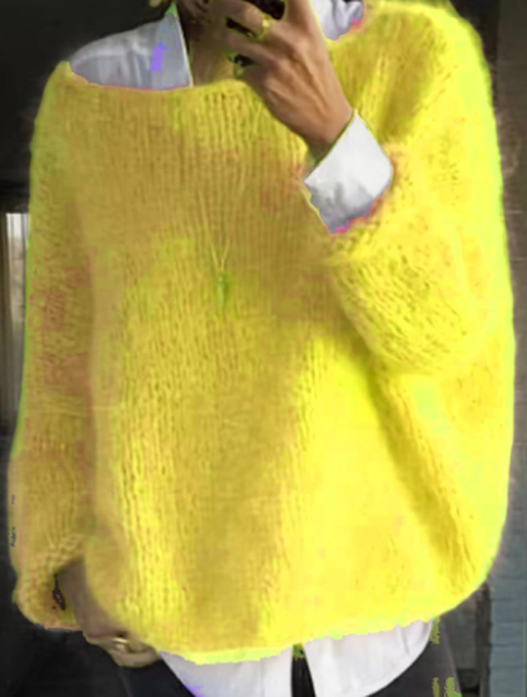 Women's cozy long sleeve sweater paired with a scarf, illustrating a complete winter ensemble.