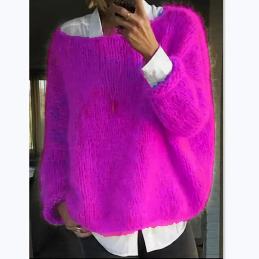 Close-up of the soft texture on a women's cozy knit long sleeve sweater, ideal for warmth.