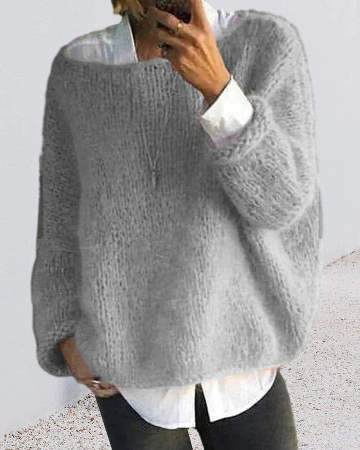Front view of a women's cozy knit long sleeve pullover sweater, highlighting its relaxed fit.