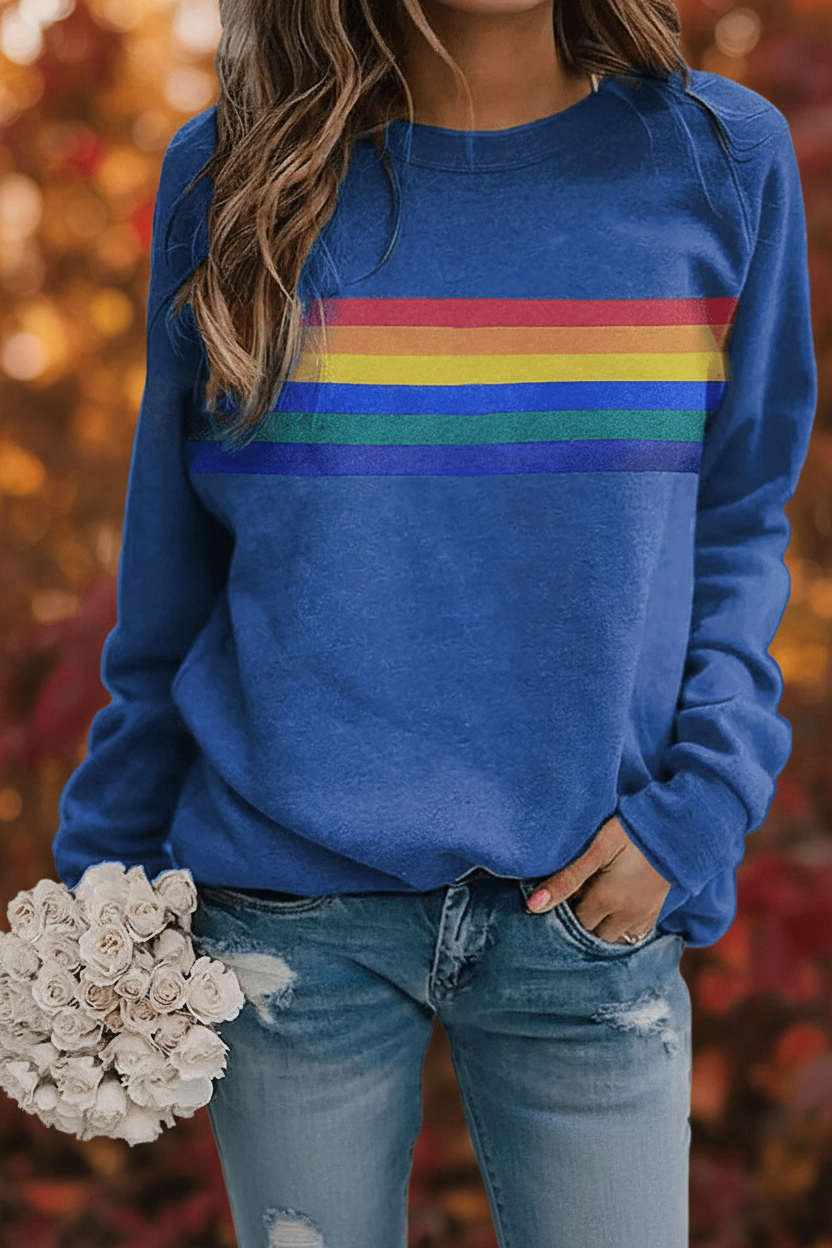 Everyday comfort in this women's cozy rainbow striped sweatshirt. Long-sleeve pullover for casual & vintage style.