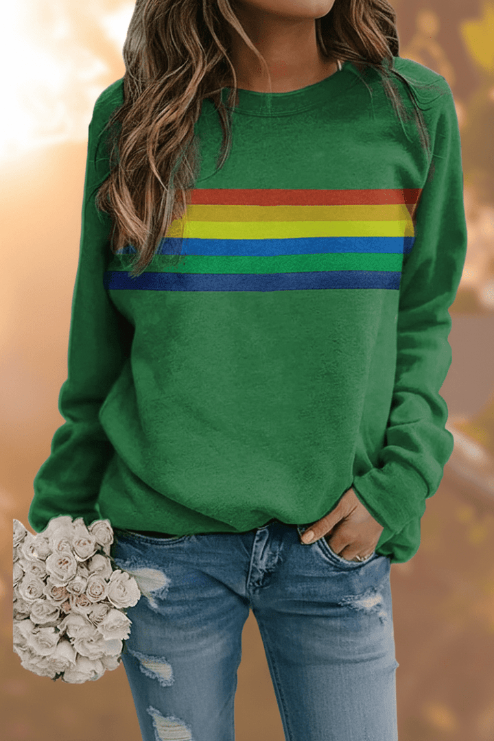 Women's long-sleeve cozy sweatshirt with playful rainbow stripes. Relaxed fit pullover, perfect casual apparel.