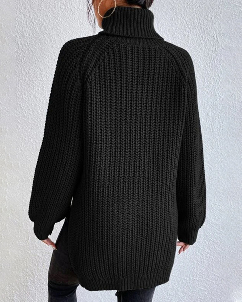 Full shot of a women's ribbed knit sweater, demonstrating its relaxed fit and long sleeve style.