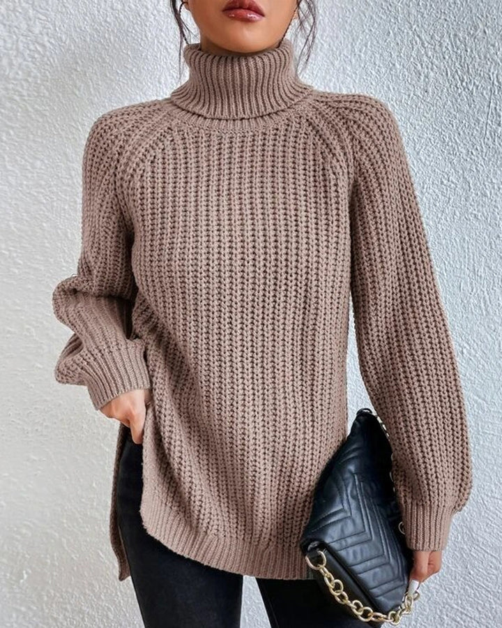 Back view of a women's long sleeve ribbed knit sweater, showing its consistent texture and cut.