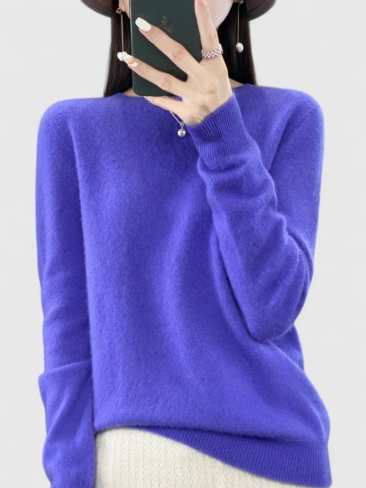 Close-up of the cozy round neckline on a women's pullover sweater.
