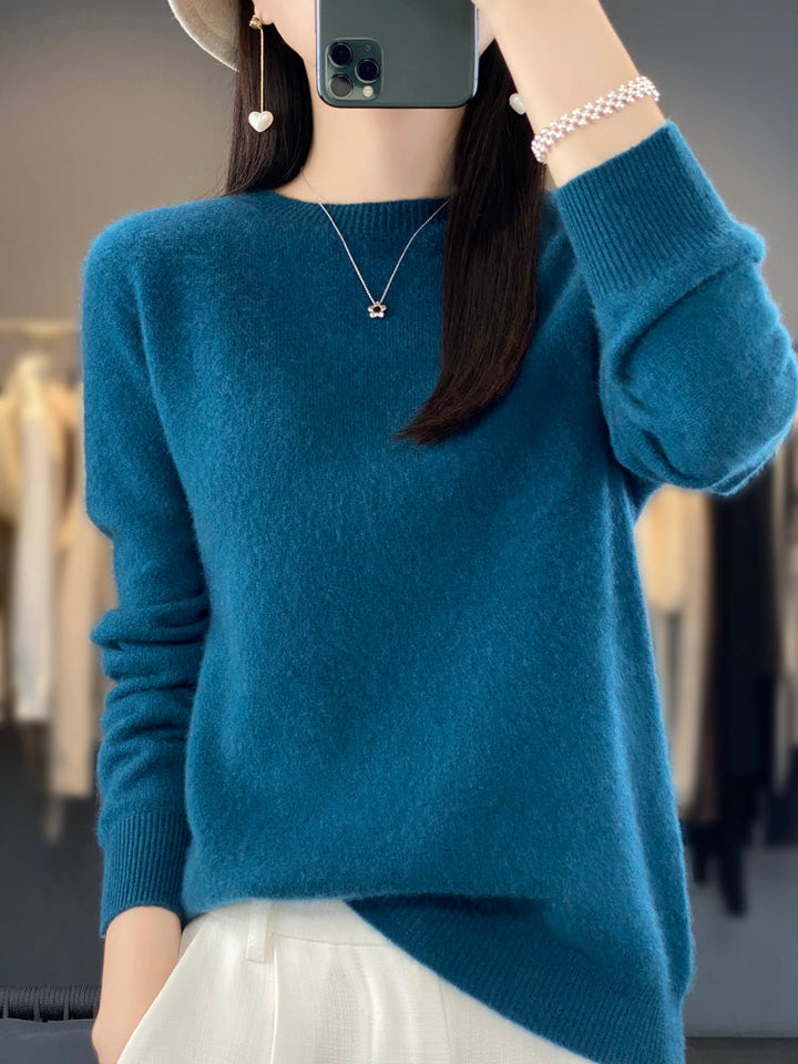 Soft knit women's cozy round neck pullover, perfect for fall and winter fashion.