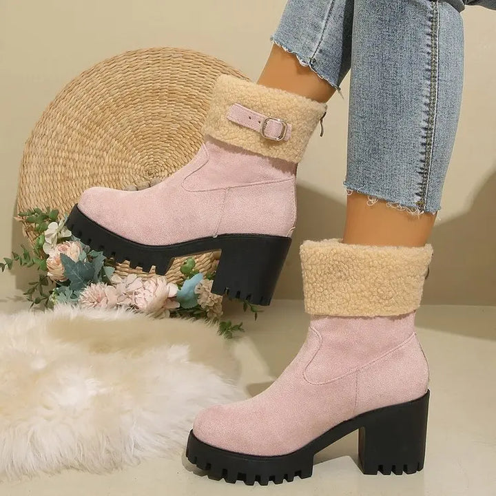 Women's block heel ankle boots featuring a plush sherpa interior, great for winter activities.