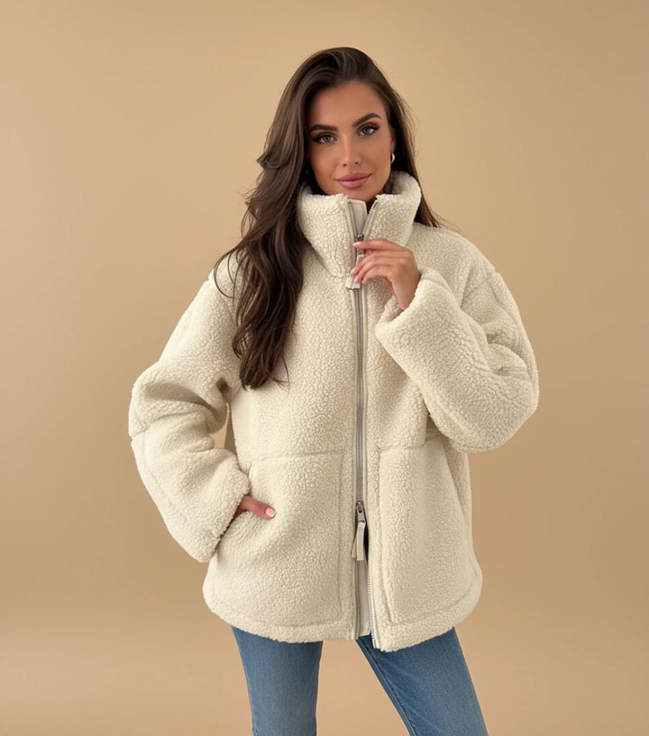 Women's cozy sherpa zip-up jacket for everyday warmth. Perfect for casual autumn & winter layering.