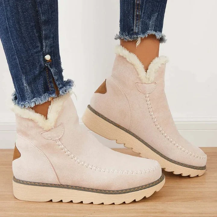 Women's cozy slip-on ankle boots, perfect for winter warmth and casual everyday comfort.