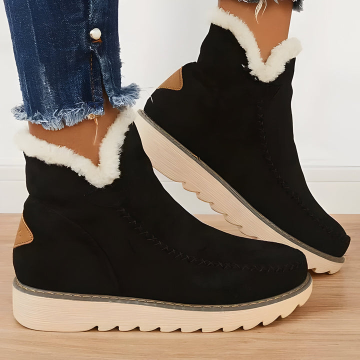Easy slip-on women's ankle boots, designed for maximum winter warmth and everyday comfortable wear.