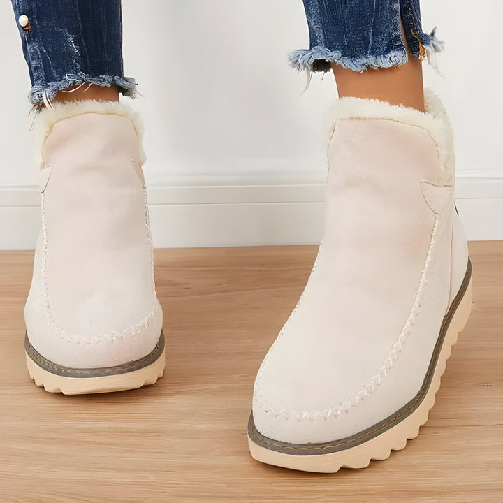 Stylish women's slip-on ankle boots, offering cozy warmth and comfort for all your winter adventures.