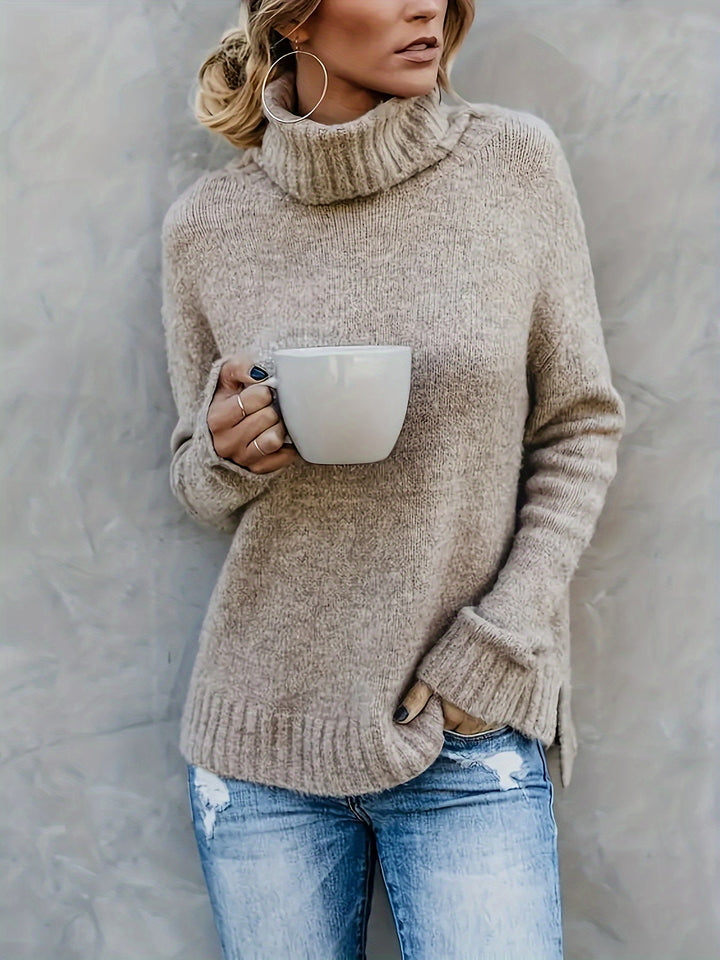 Women's cozy turtleneck sweater, relaxed fit with stylish split hem for fall fashion.