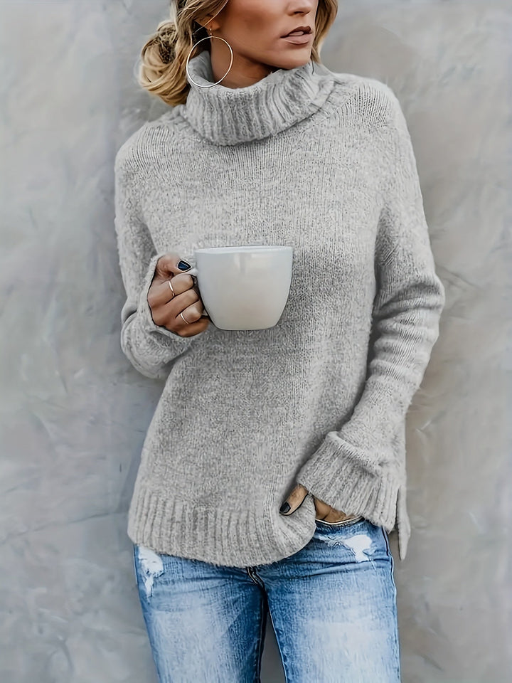 Relaxed fit women's turtleneck sweater, split hem, essential for fall & winter fashion.