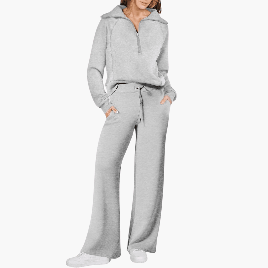 Cozy women's two-piece lounge set with zip-up hoodie & drawstring wide-leg pants for casual comfort.