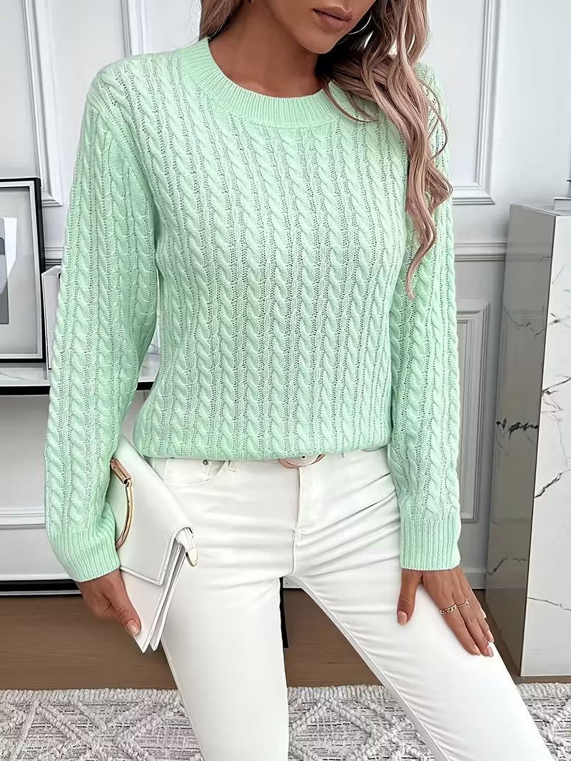 Elegant women's cable knit crew neck jumper with intricate patterns. A cozy essential for autumn layering.