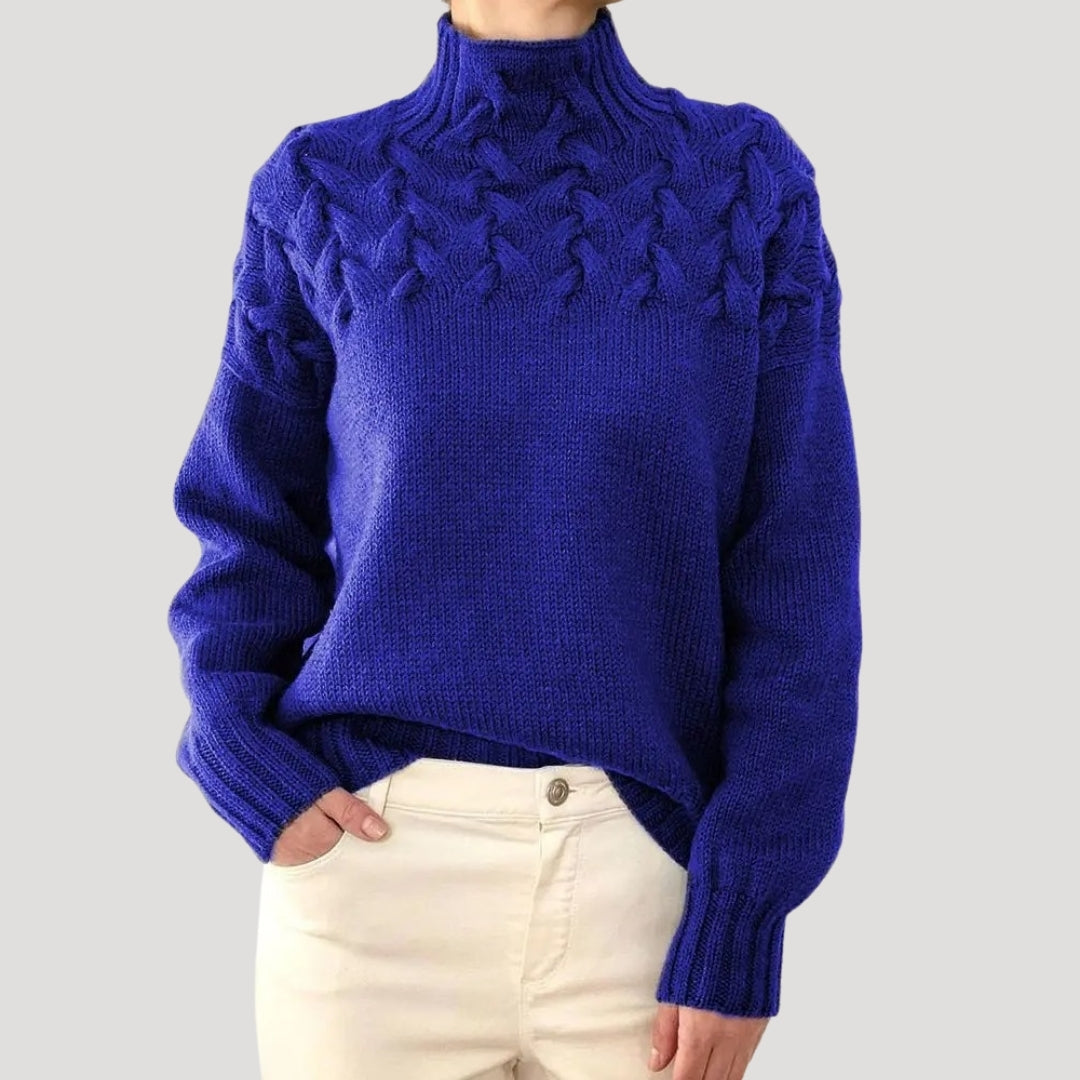 Stylish women's cable knit high-neck sweater in a solid color, perfect for spring fashion