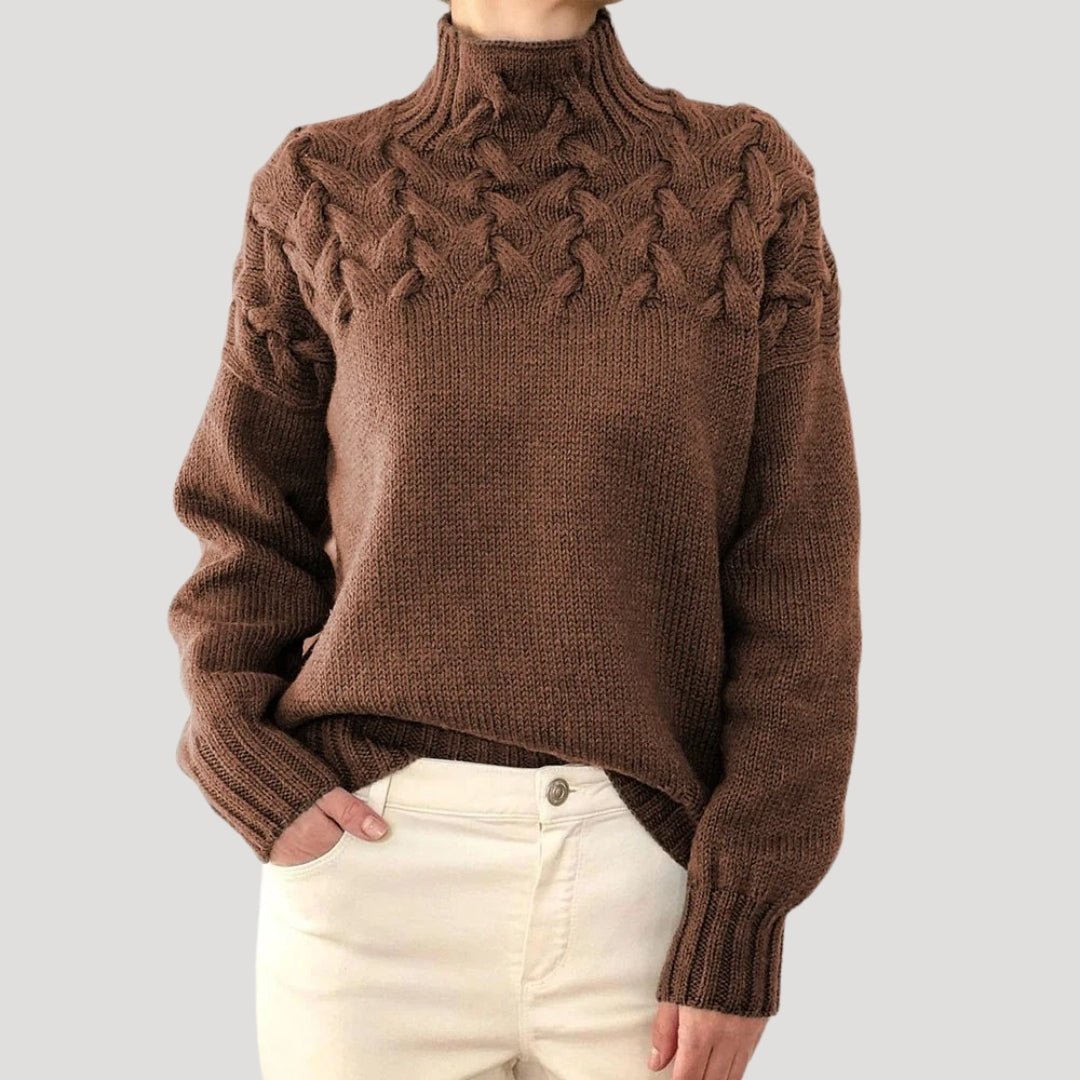 Detailed shot of the high-neck collar on a women's cable knit spring sweater, fashion accent