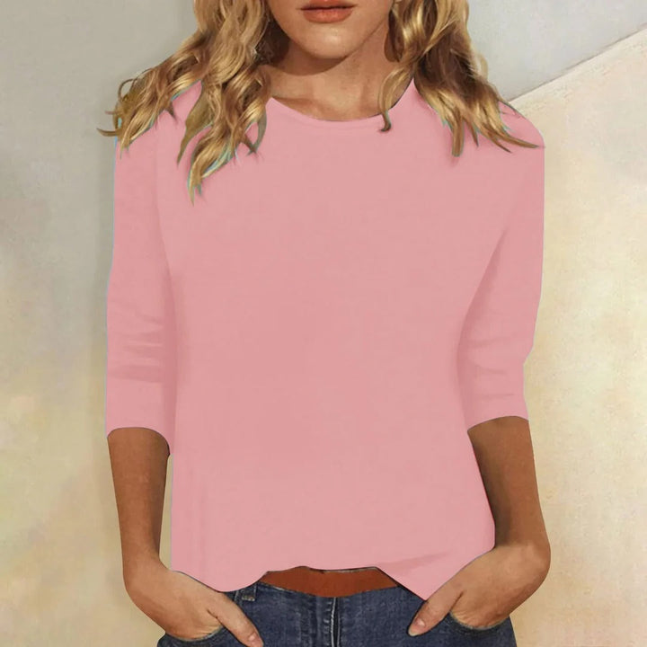 Women's crew neck 3/4 sleeve relaxed fit top in a versatile everyday style.