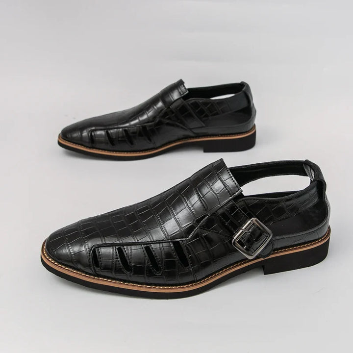 High-angle view of fashionable women's croc embossed leather buckle sandals