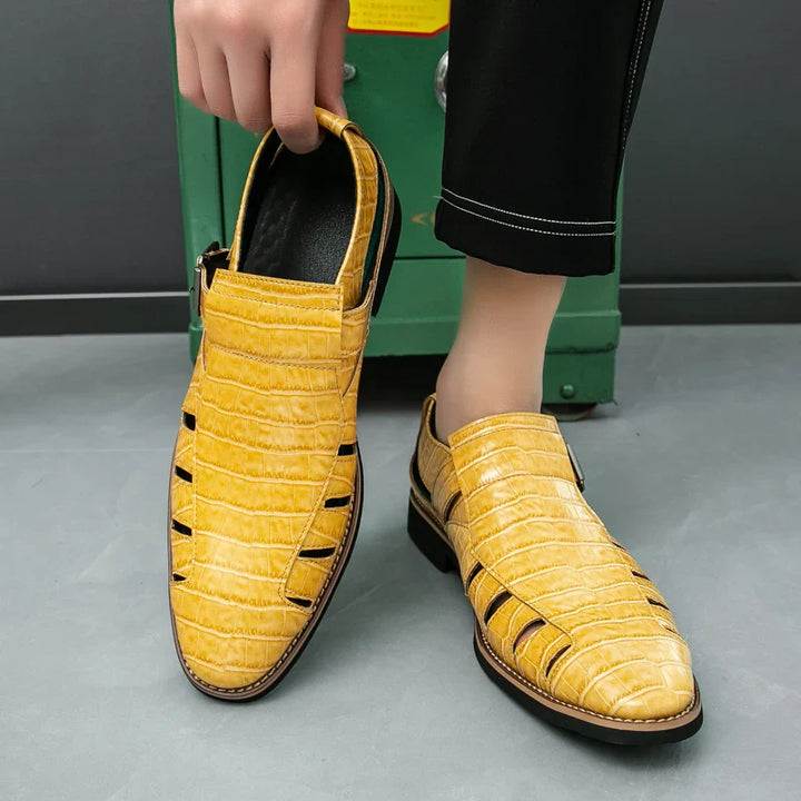 Detail shot of the polished buckle on women's croc embossed summer sandals