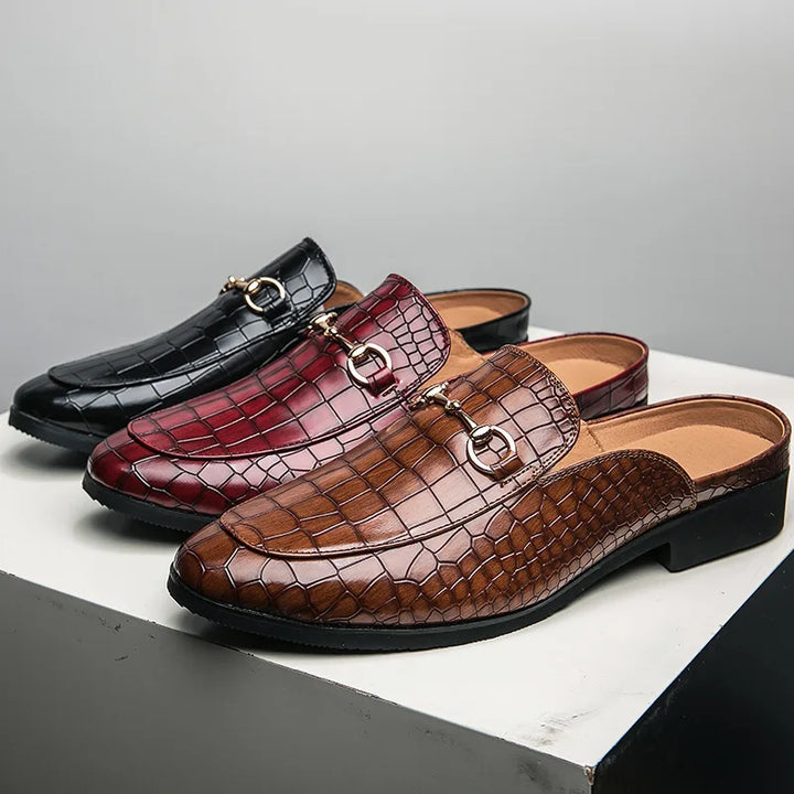 Stylish women's loafer mules with a sophisticated croc-embossed texture and easy slip-on design