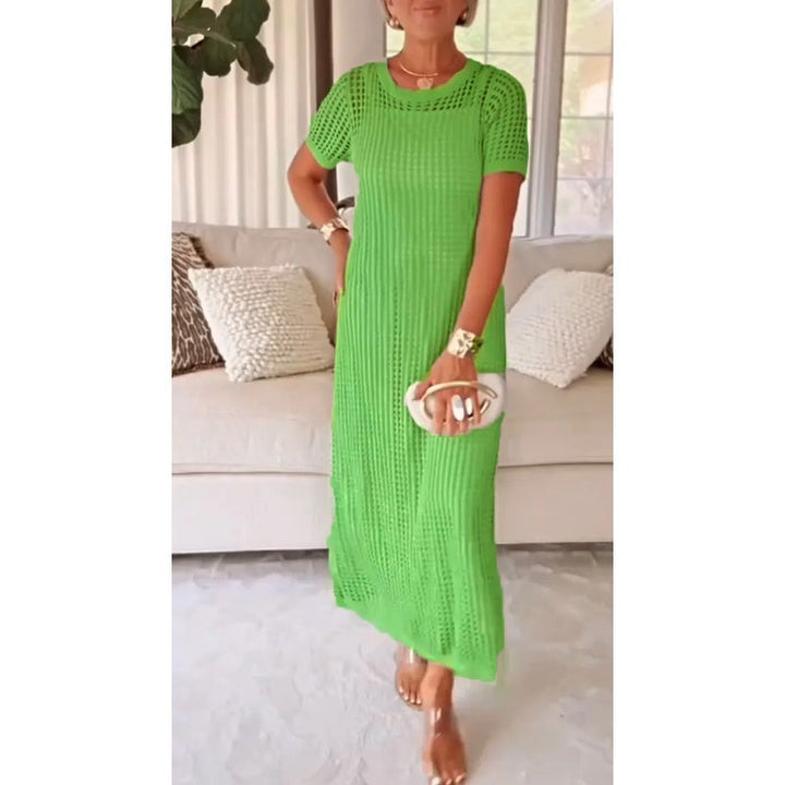 Women's short sleeve maxi dress with intricate crochet open weave, elegant, flowy resort style.