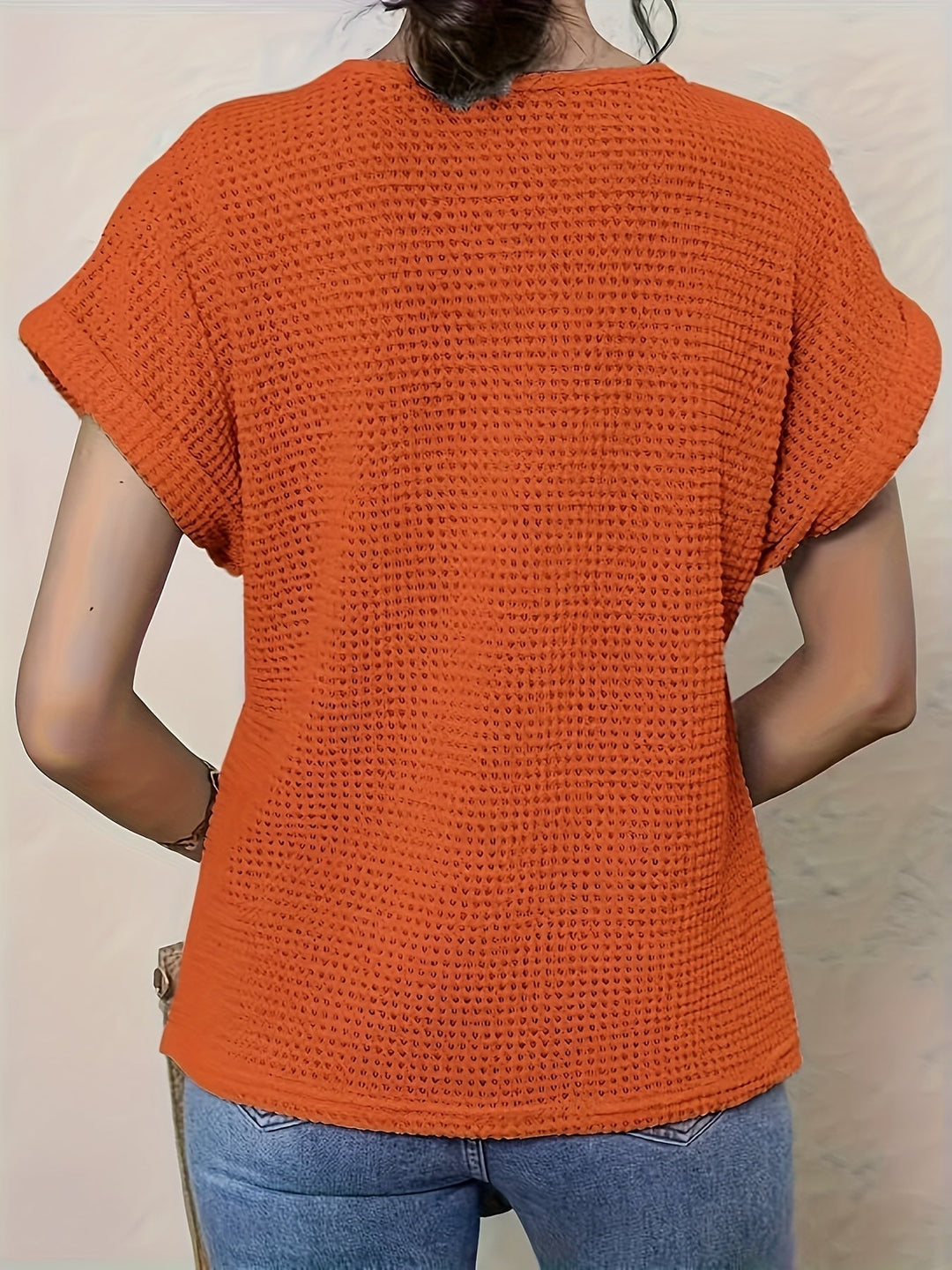 Stylish women's round neck blouse with intricate crochet-style detailing and comfortable short sleeves.