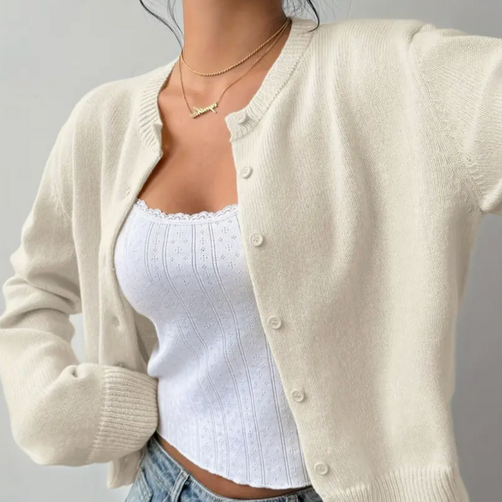 Close-up of lightweight, cropped button-front cardigan for women, casual style