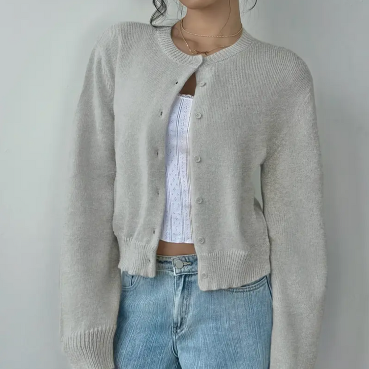 Front view of a women's cropped button-up cardigan, casual & comfortable