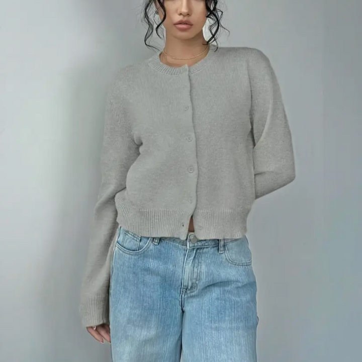 Texture detail of a lightweight, cropped knit cardigan for women, breathable