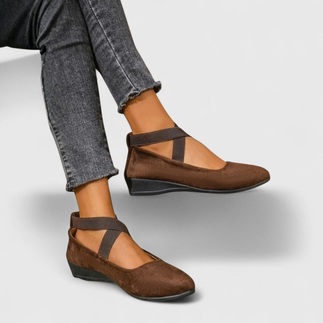 Women's closed-toe wedge sandals with elastic crossover straps. Elegant & comfortable summer footwear.