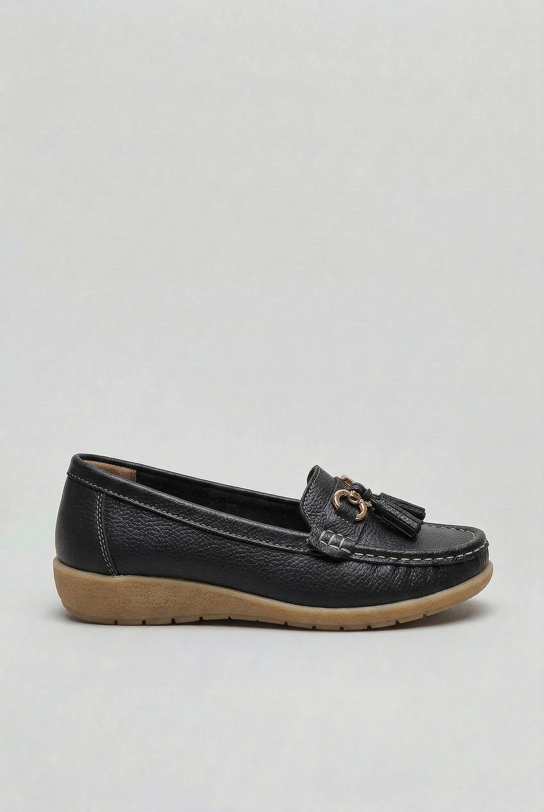 Side view of women's cushioned slip-on loafers, showcasing their sleek, comfortable design.