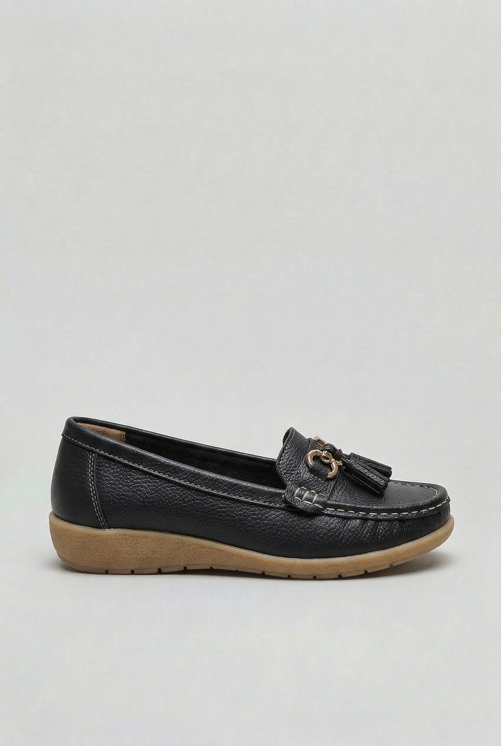 Side view of women's cushioned slip-on loafers, showcasing their sleek, comfortable design.