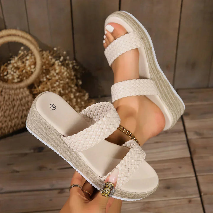 Stylish women's wedge sandals with cushioning, ensuring all-day comfort for summer adventures.
