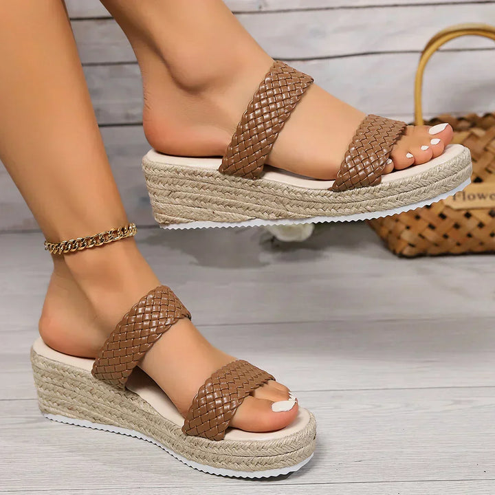 Stylish women's wedge sandals, cushioned for comfort, suitable for casual summer footwear.