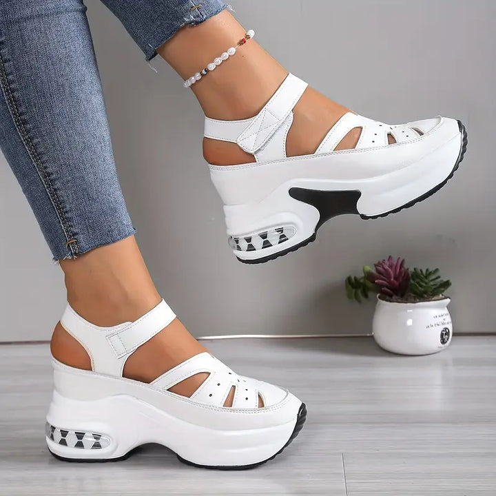 Breathable cutout wedge sandals for women, featuring cushioned insoles & comfortable platform.