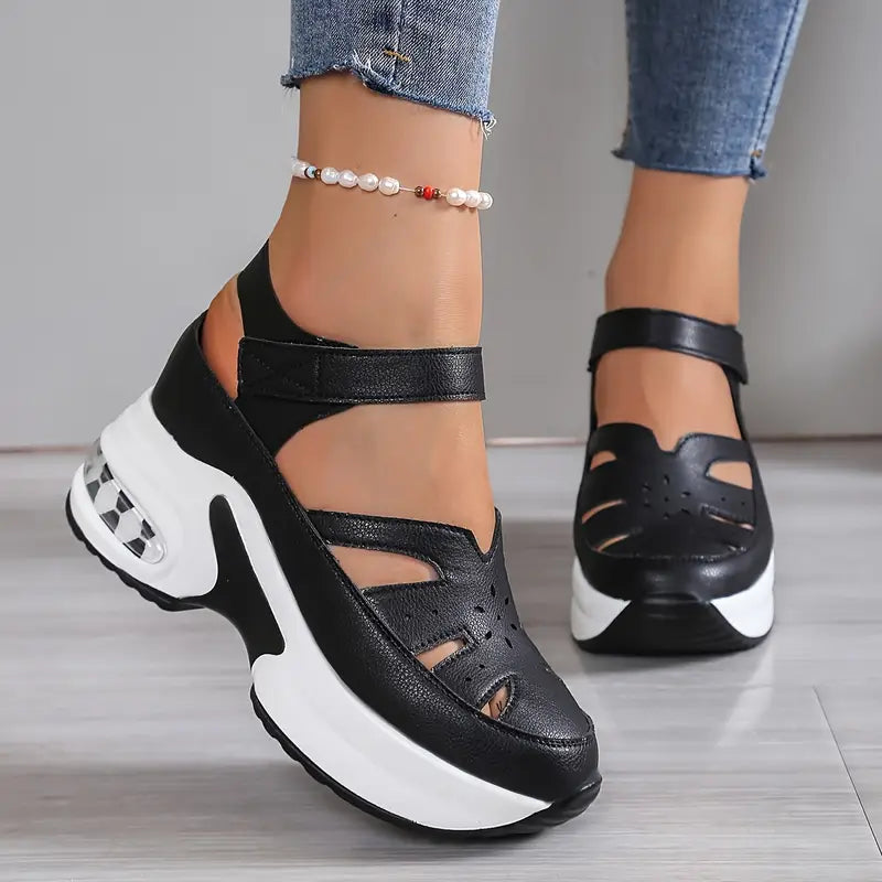 Comfortable women's cushioned wedge sandals with a breathable cutout design and secure fit.