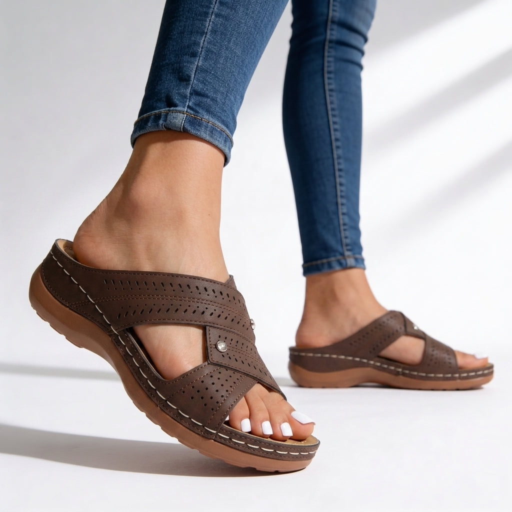 Women's cushioned wedge sandals with stylish crossover straps & peep toe, ideal for summer comfort.