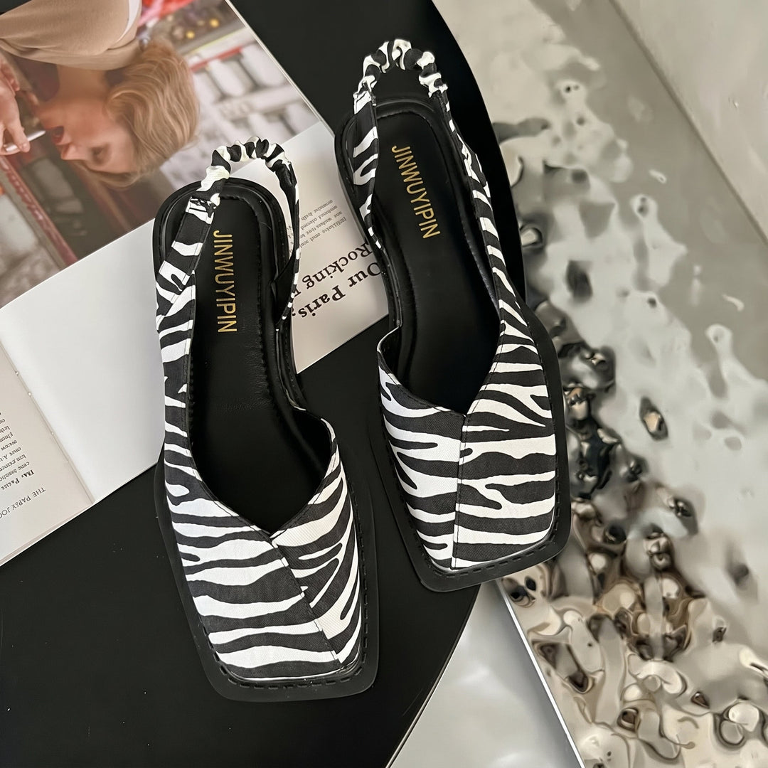 Stylish women's Daisy block heel slingback sandals, modern square toe design. Chic and versatile summer footwear.