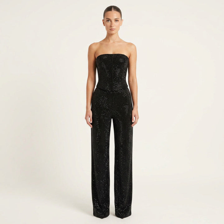 Women's dazzling glitter crop top and high-waist jeans two-piece set for a stylish party outfit.