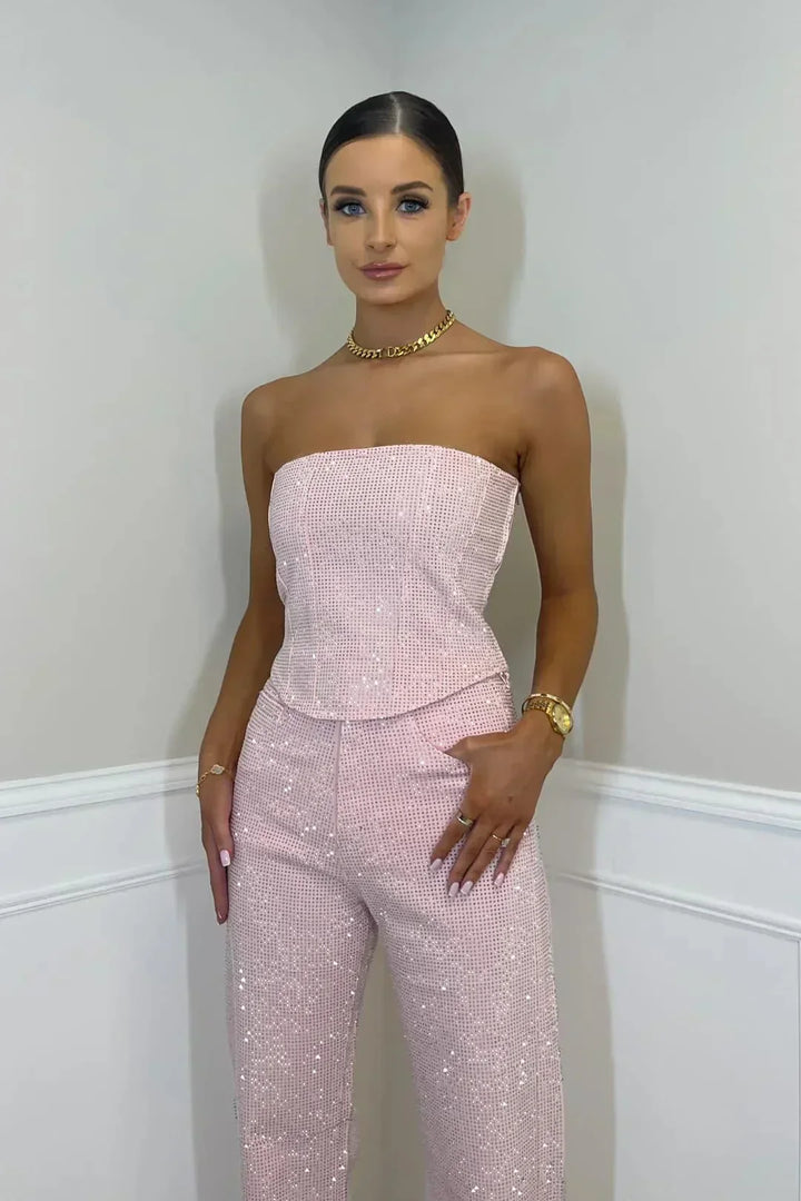 Sophisticated women's glitter crop top and high-waist jeans set, showcasing contemporary party wear.