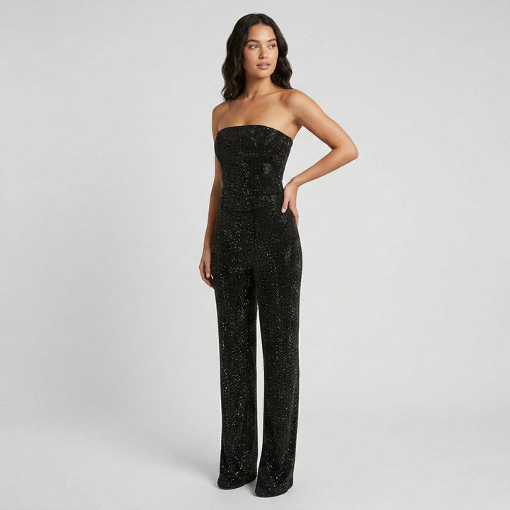 Chic women's glitter crop top and high-waisted denim jeans matching set, perfect for night out fashion.