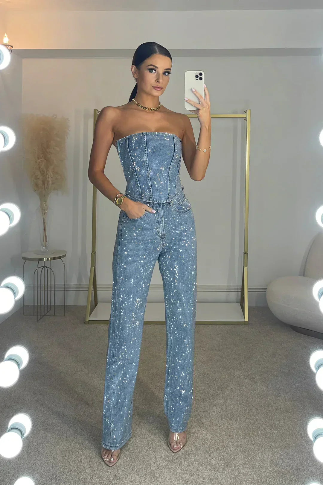 Dazzling women's glitter crop top & high-waist jeans matching set, a trendy choice for any event.