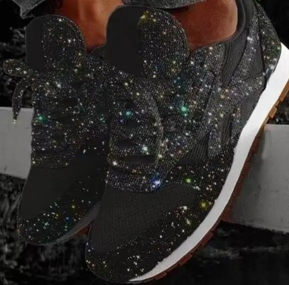 Woman wearing dazzling glitter lace-up sneakers, walking outdoors. Trendy, comfortable women's fashion shoes.