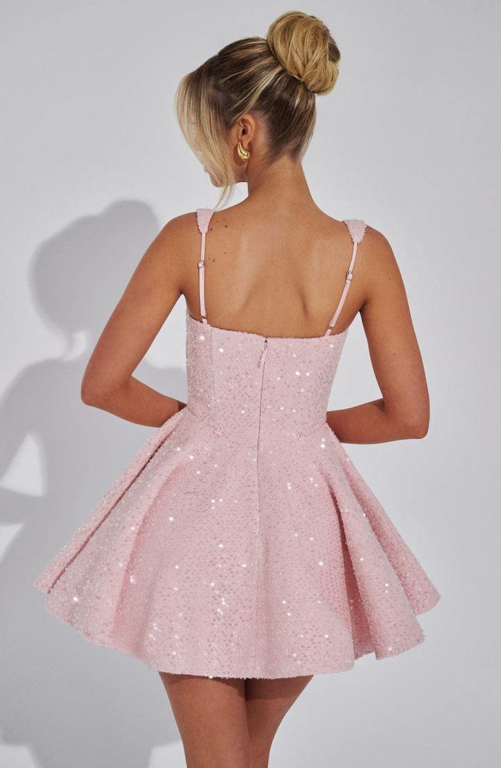 Dazzling pink sequin party dress for women, backless with a striking bow, ideal for evening events.