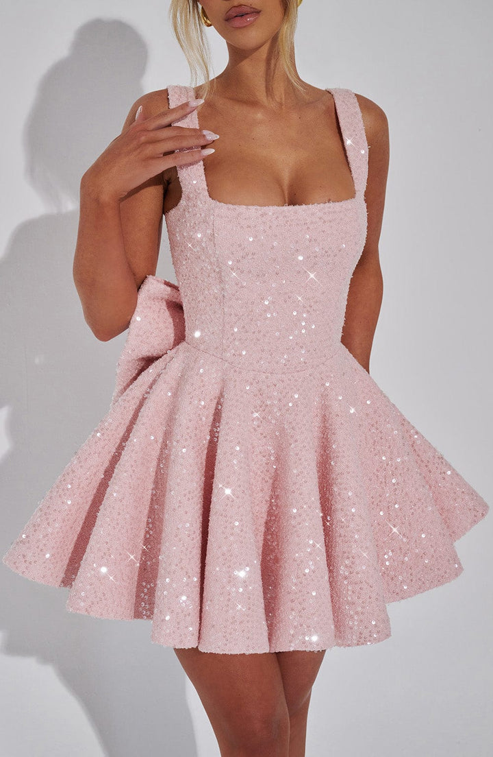 Front view of a sparkling pink sequin mini dress for women, a glamorous choice for any special occasion.